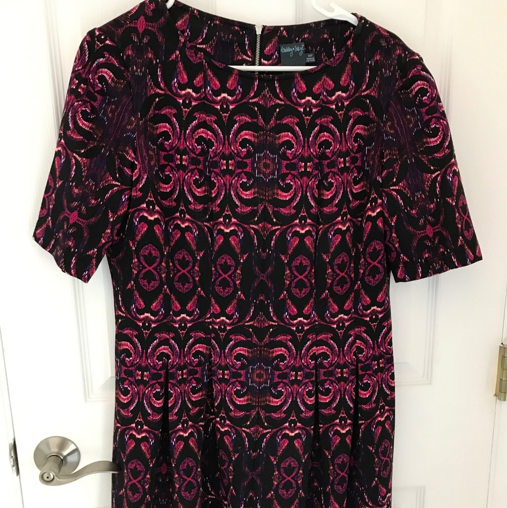 Dress with hues of pinks, reds and black
